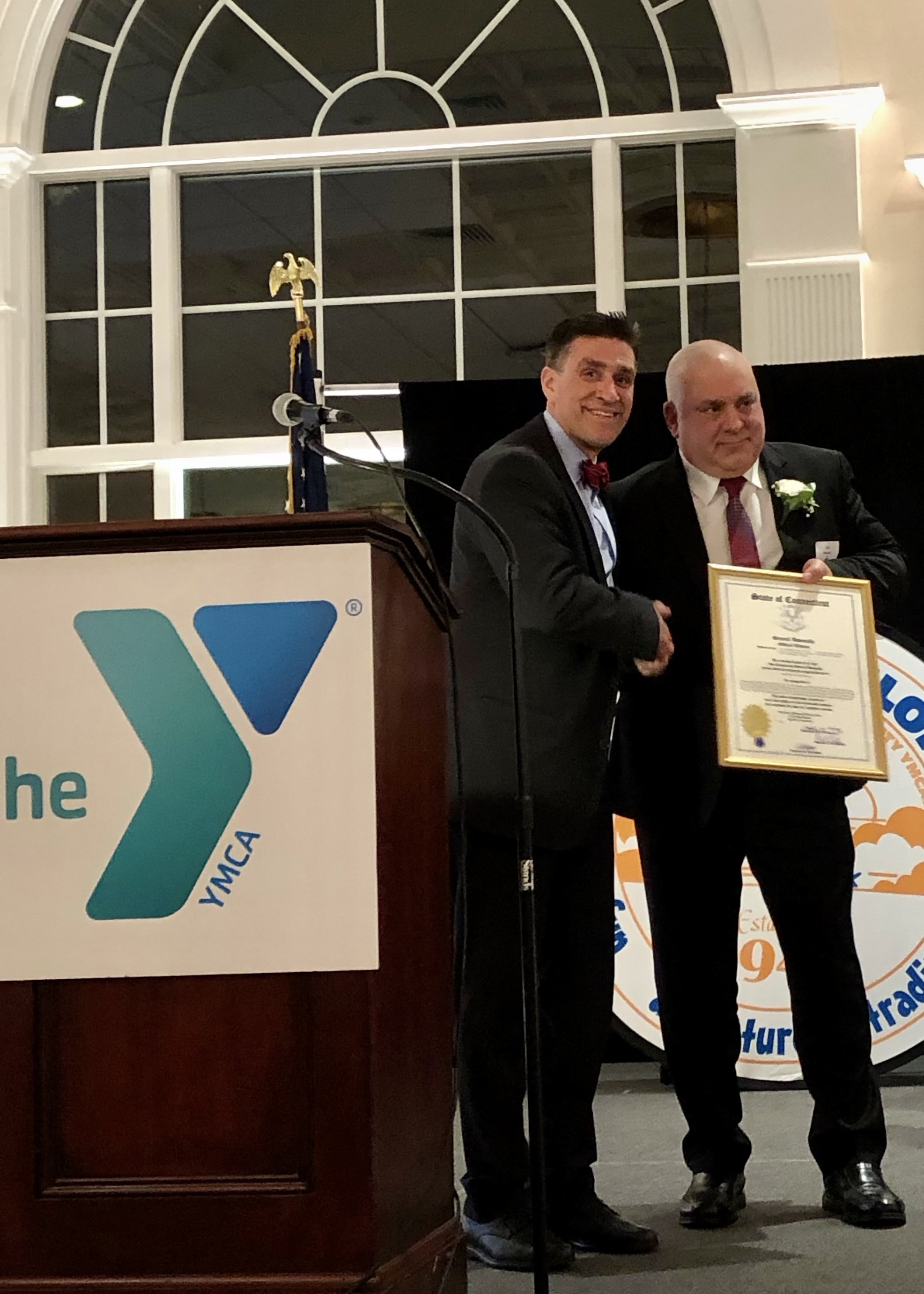Southington Deputy Police Chief William Palmieri gets an Official Citation from the Connecticut General Assembly as he was honored by the Southington-Cheshire Community YMCA as its Person of the Year at the Aqua Turf Club.